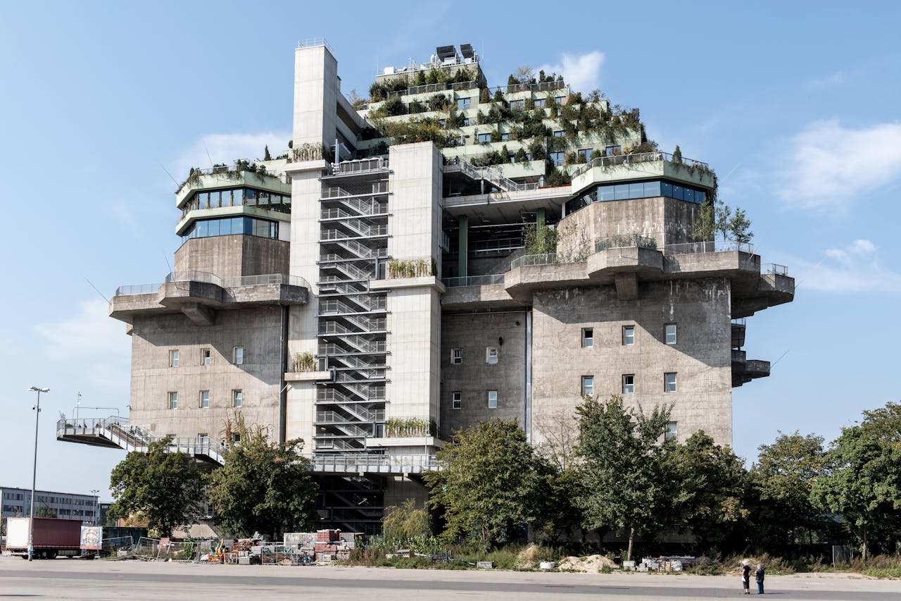 Modern sustainable building with greenery on rooftop in Hamburg.